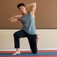 Marcus Chen, power yoga instructor demonstrating strength and balance