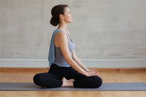 Instructor demonstrating gentle Hatha yoga poses for beginners in a calm studio setting